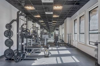 Gym with variety of equipment's at Grand Central Market Apartments, California, 90013